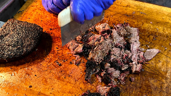pork being chopping on a wooden board