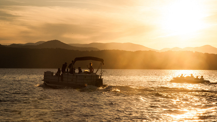 Boaters take in the sunrise over Lake Jocassee.