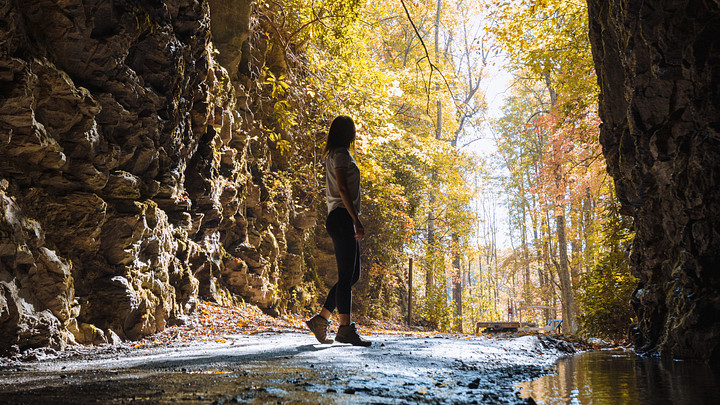 woman standing in Stumphouse Tunnel 