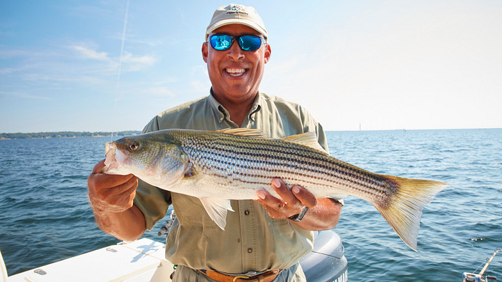 Captain Mike Glover  holding a fish