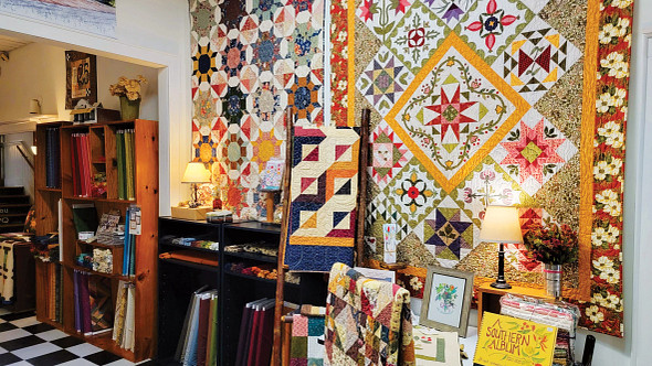 display of quilts on the wall